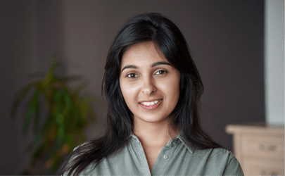 young business woman smiling into camera