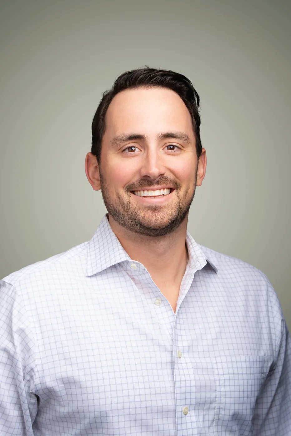 Headshot portrait of Ryan Johnson, Exec Director