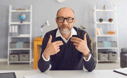 man in blue shirt facing forward point to himself