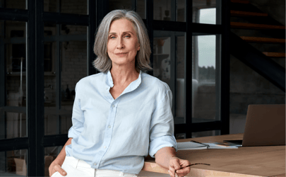 industry leader leaning against desk