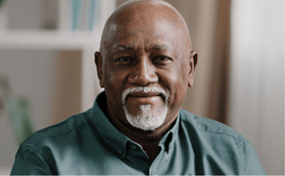 closeup portrait of man smiling slightly 