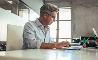 A chief operating officer executive working at their desk.