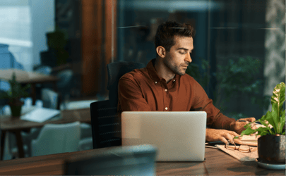 person sitting at desk calculating turnover cost