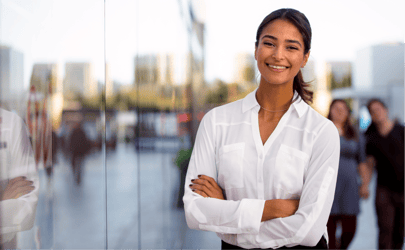 sales director outside smiling with arms crossed