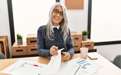 Woman happily looking through documents.