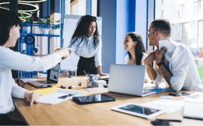 Group of professionals working around a table.