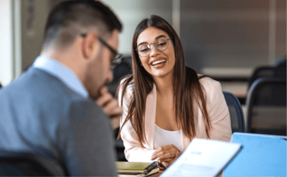 headhunter looking at a resume during an interview