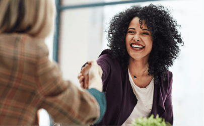 woman shaking someone's hand