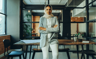 person in office with arms crossed