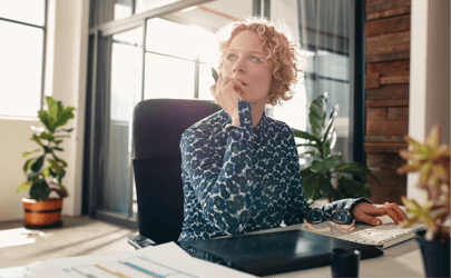 women concentrating at desk 