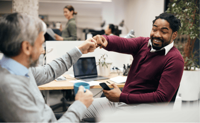 Two professionals fist-bumping. 