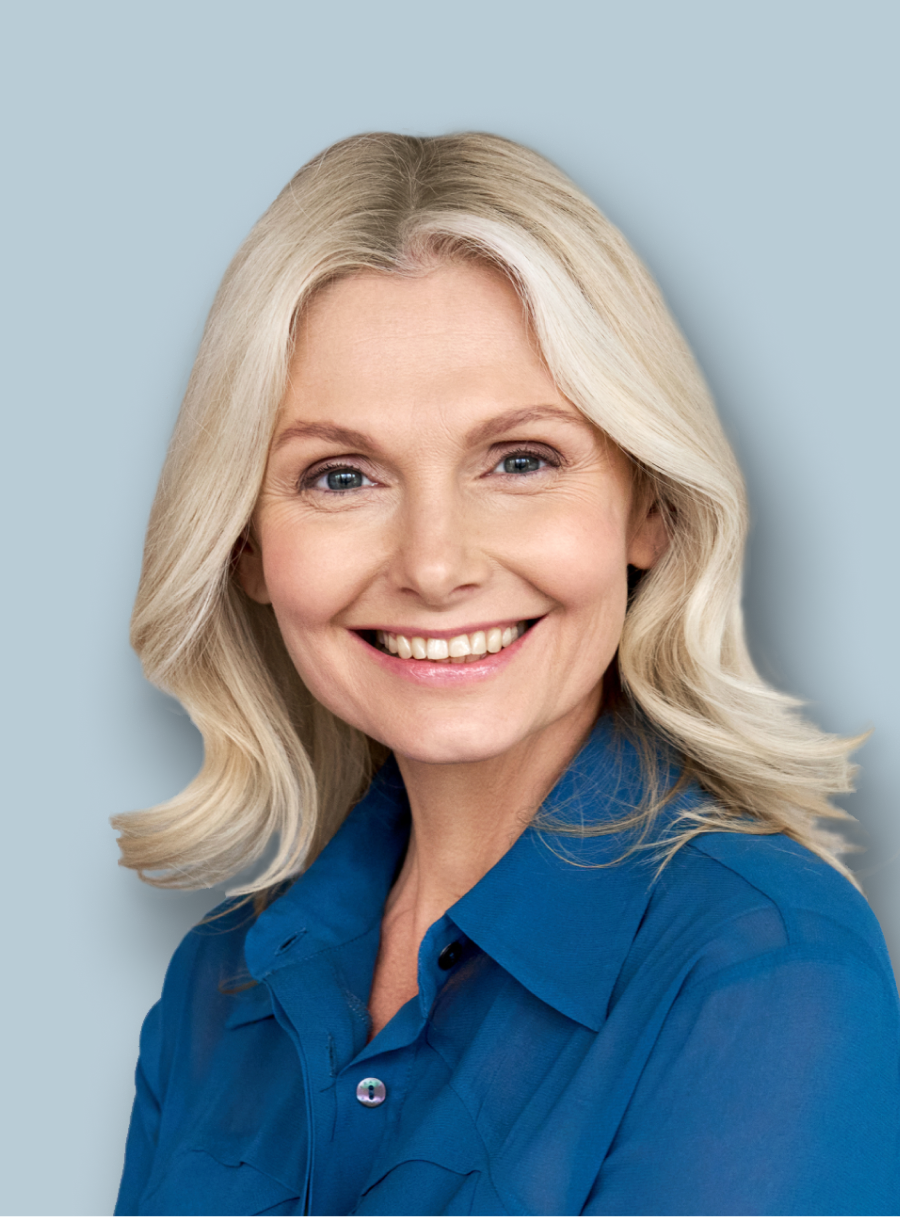 portrait of a business woman in a blue shirt smiling to the camera