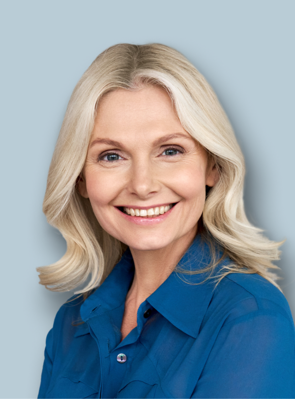 portrait of business woman with blonde hair wearing a blue collared shirt smiling