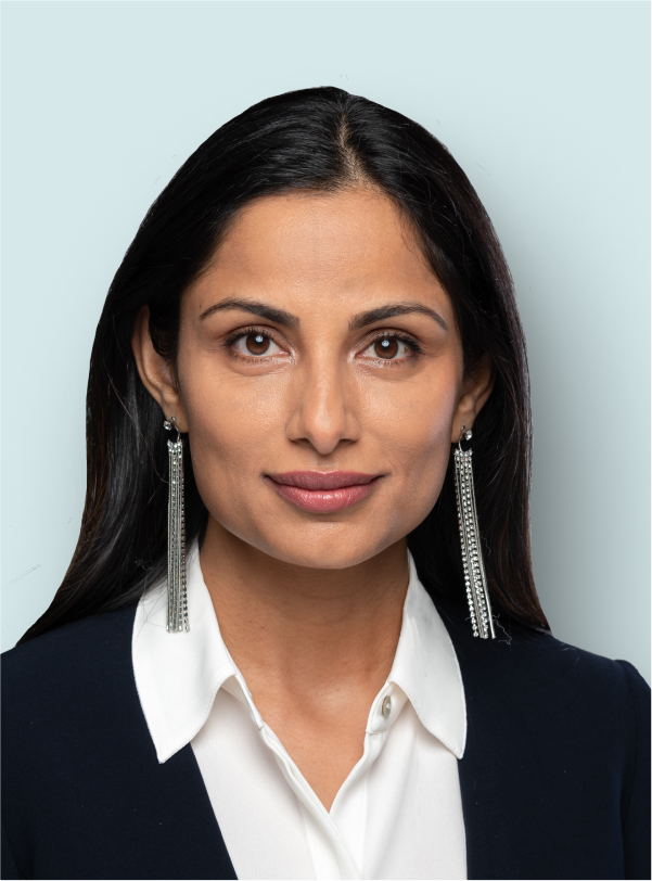 woman with long earrings and business suit