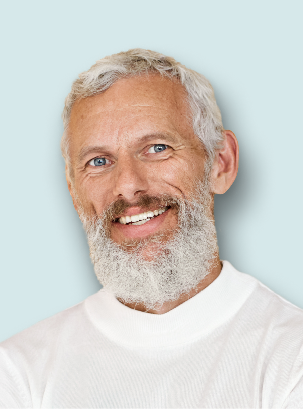 portrait of man with beard and white shirt smiling