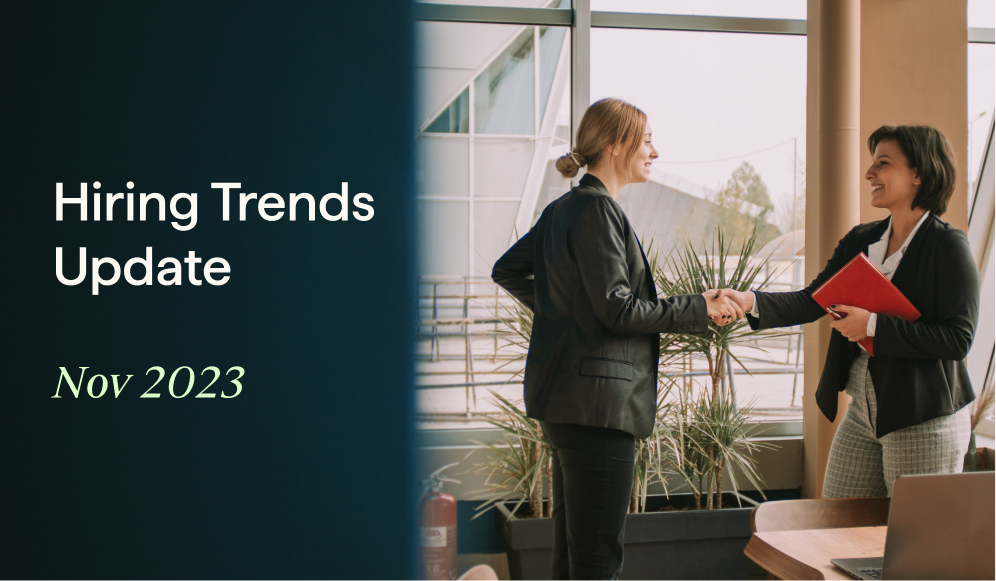 two women shaking hands in an office. overlay with "Hiring Trends Update Nov 2023" on the side.