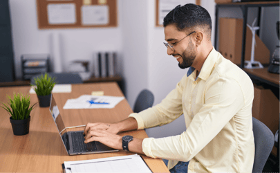 a guy using excel on a computer