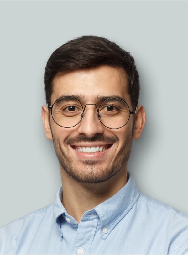 portrait of man with glasses smiling