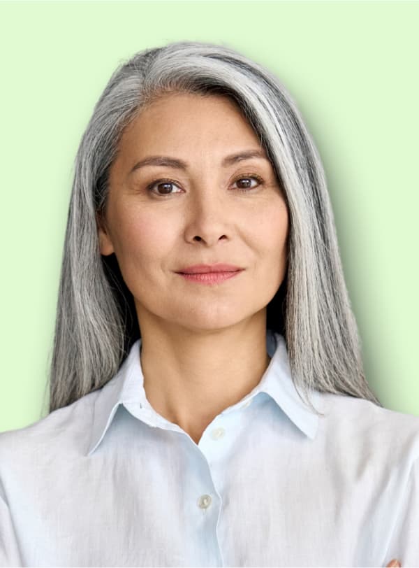 Portrait of woman in blue blouse grinning